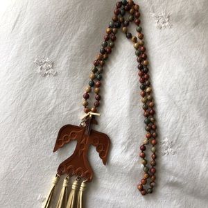Necklace w/leather thunderbird & leather fringe.